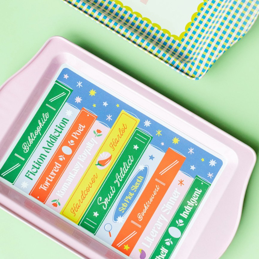 A Jollity & Co bookish tray painted with colorful book spines
