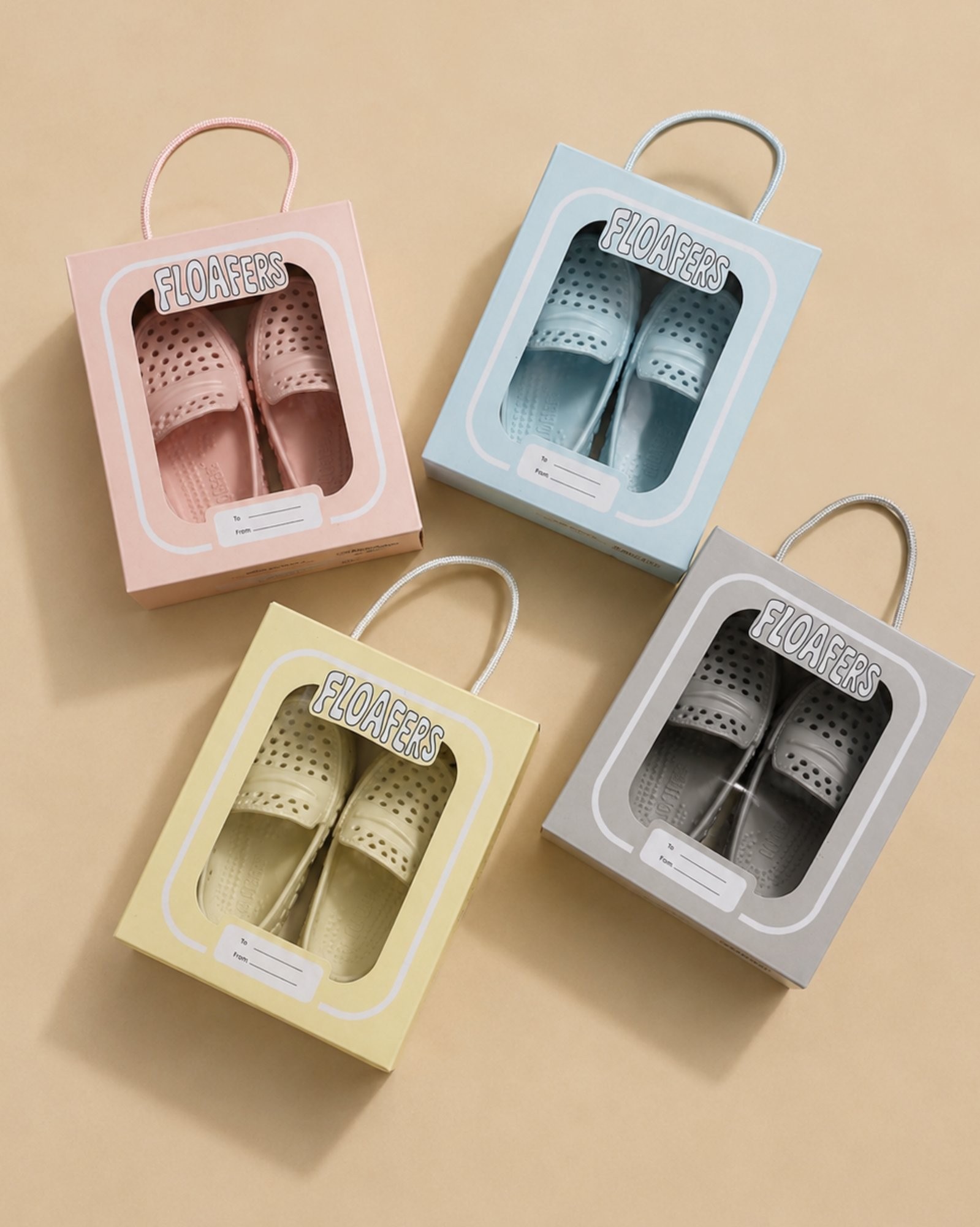 Four pastel pairs of Floafers in gift boxes with rope handles
